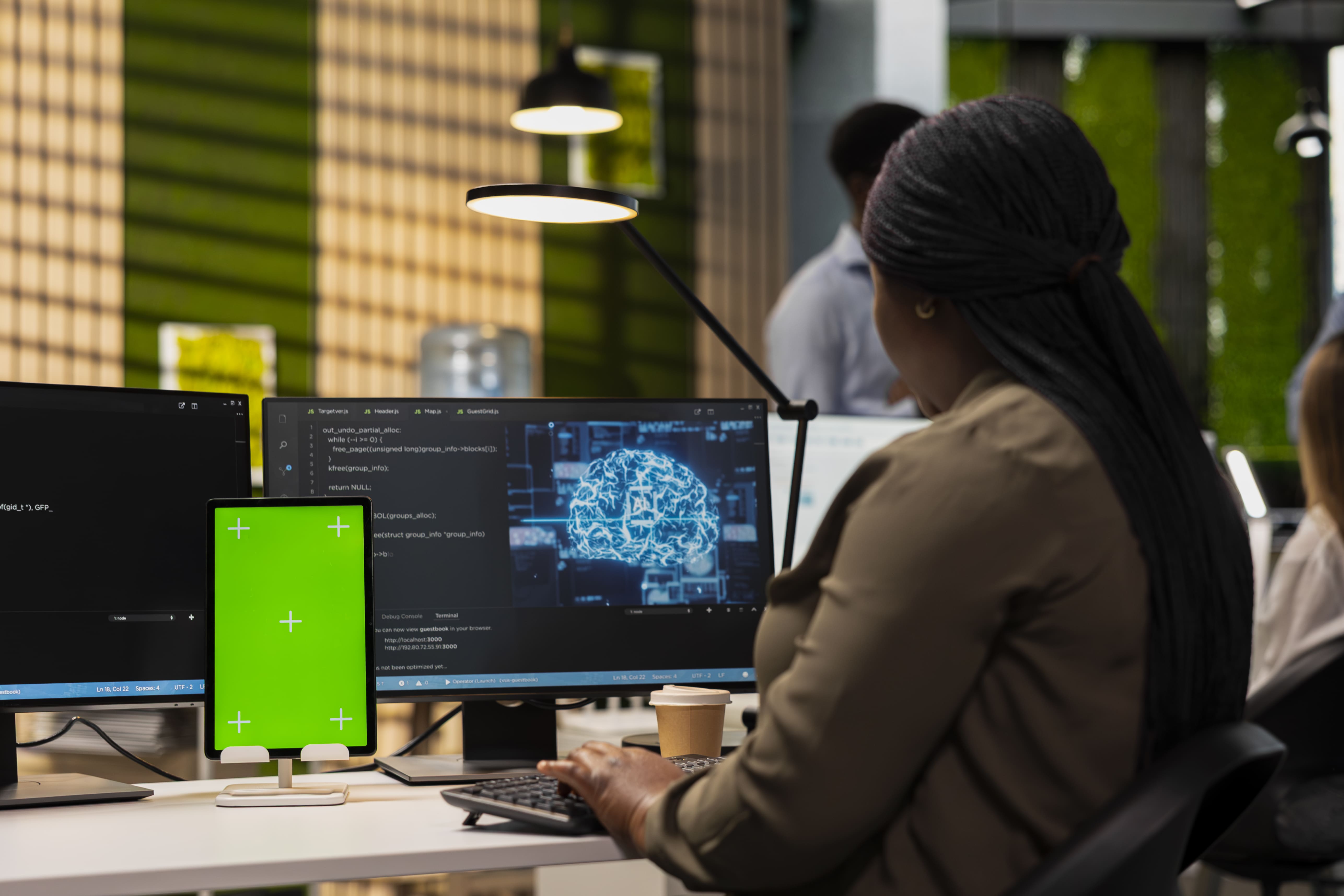 Engineer reviewing AI model running across multiple monitors