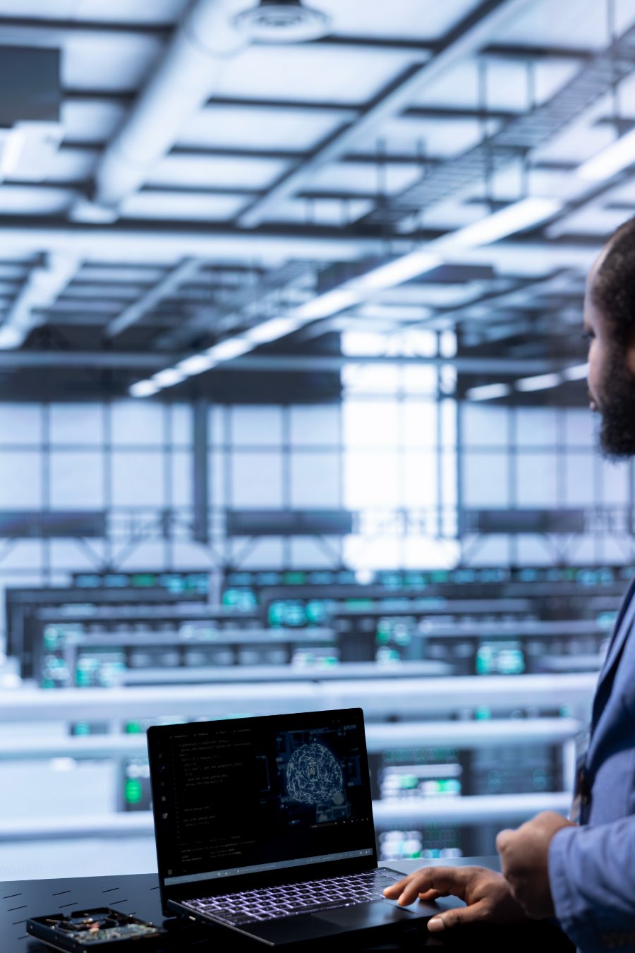 Server room worker overseeing AI systems