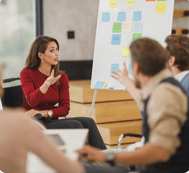 A Scadea teammate presenting at a whiteboard during a real working session