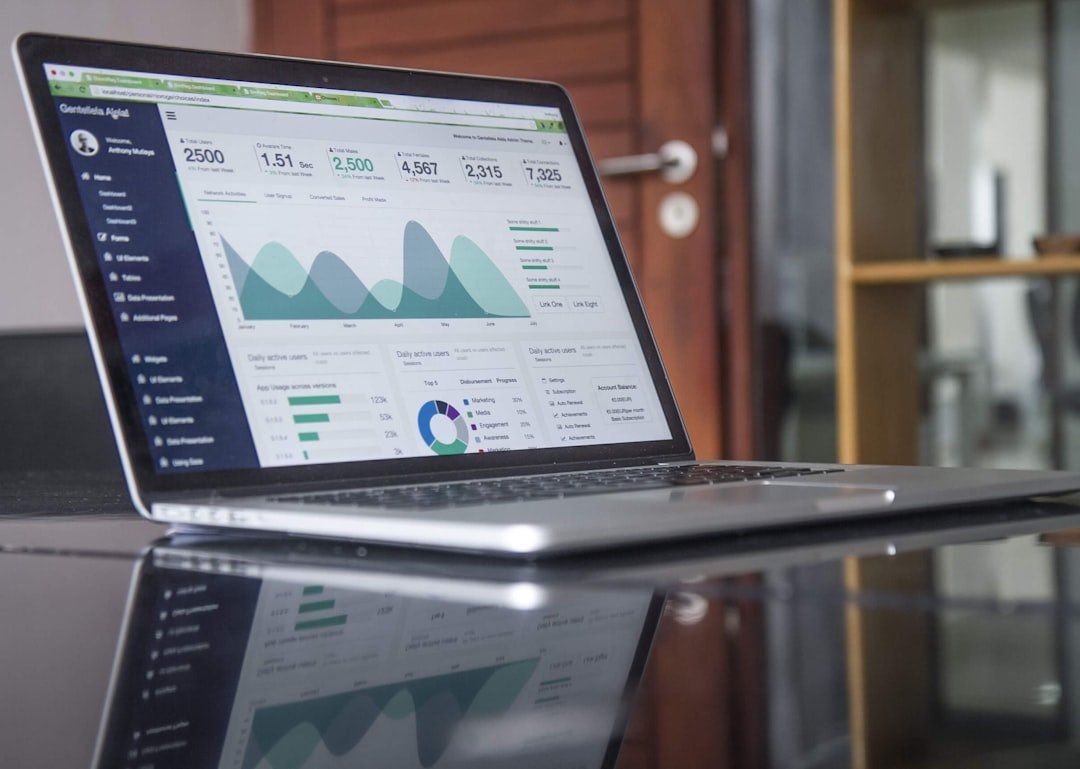 Hands on a laptop with an industrial data overlay