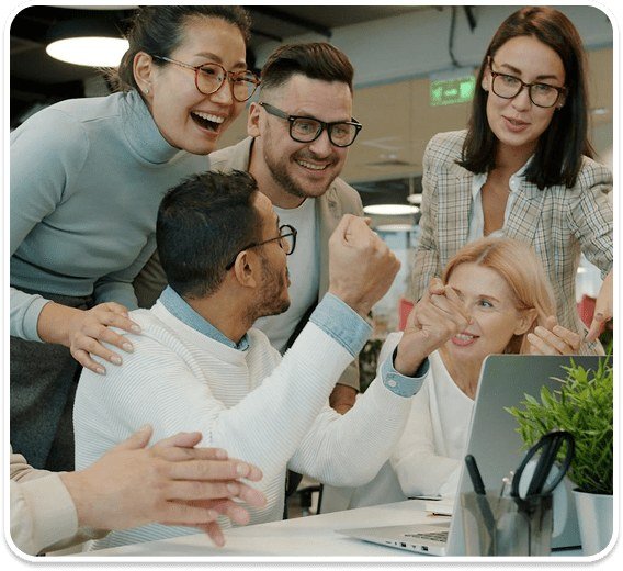 Scadea team members smiling and celebrating together in a bright office