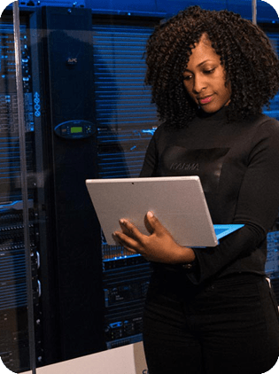 Woman with tablet in a server room.