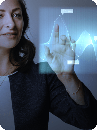 Woman touching a holographic data graph.